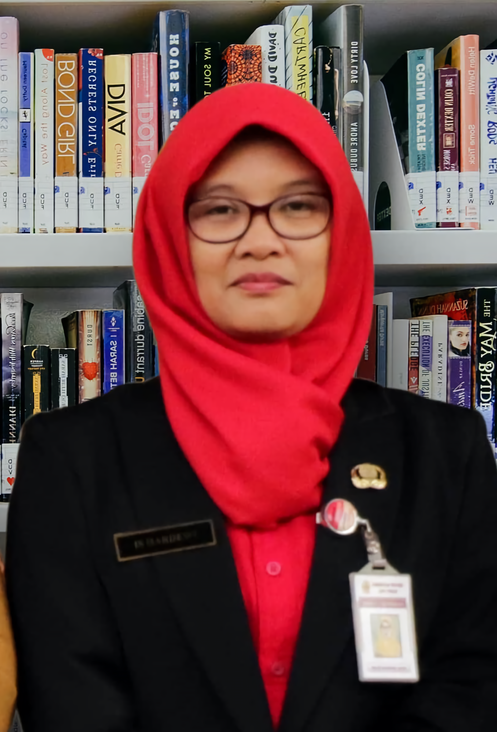 Dra. Is Hardewi, M.Pd.